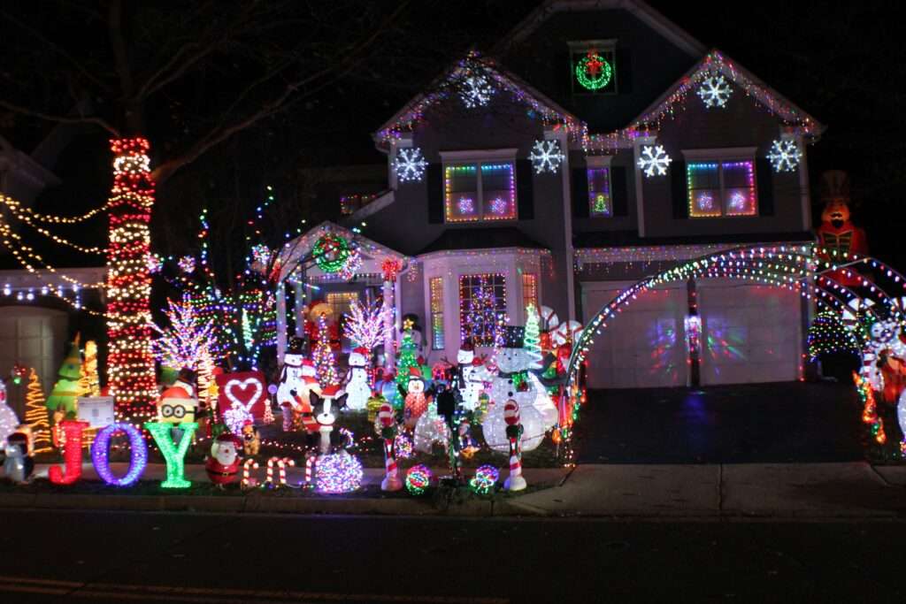 Season of Joy - A home decorated to the hilt with everything imaginable! Snowflakes, wreaths, snowmen, trees, Santas, and even minions!